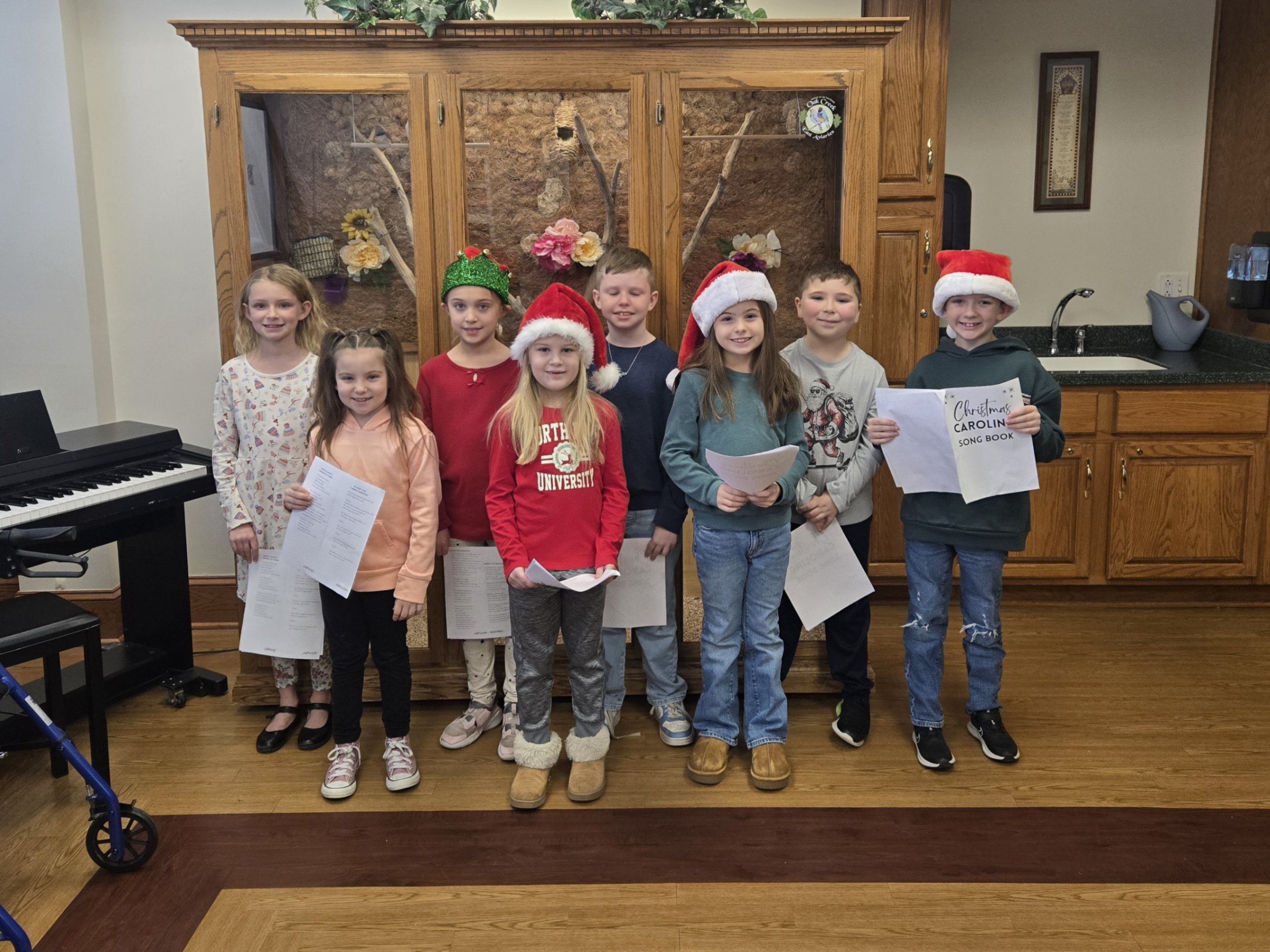 A group of students singing to residents of Jefferson Manor.